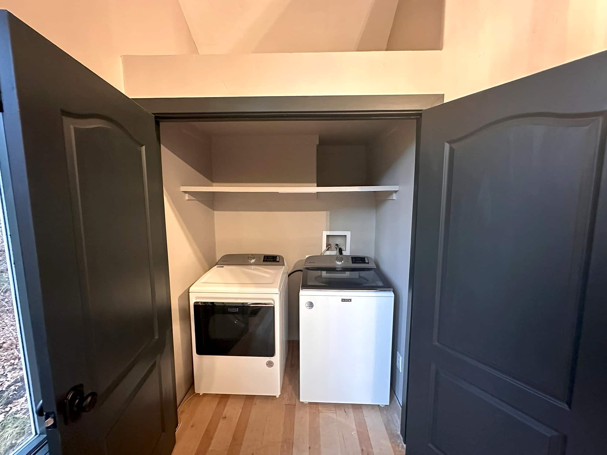 Full-size washer and dryer in the utility closet